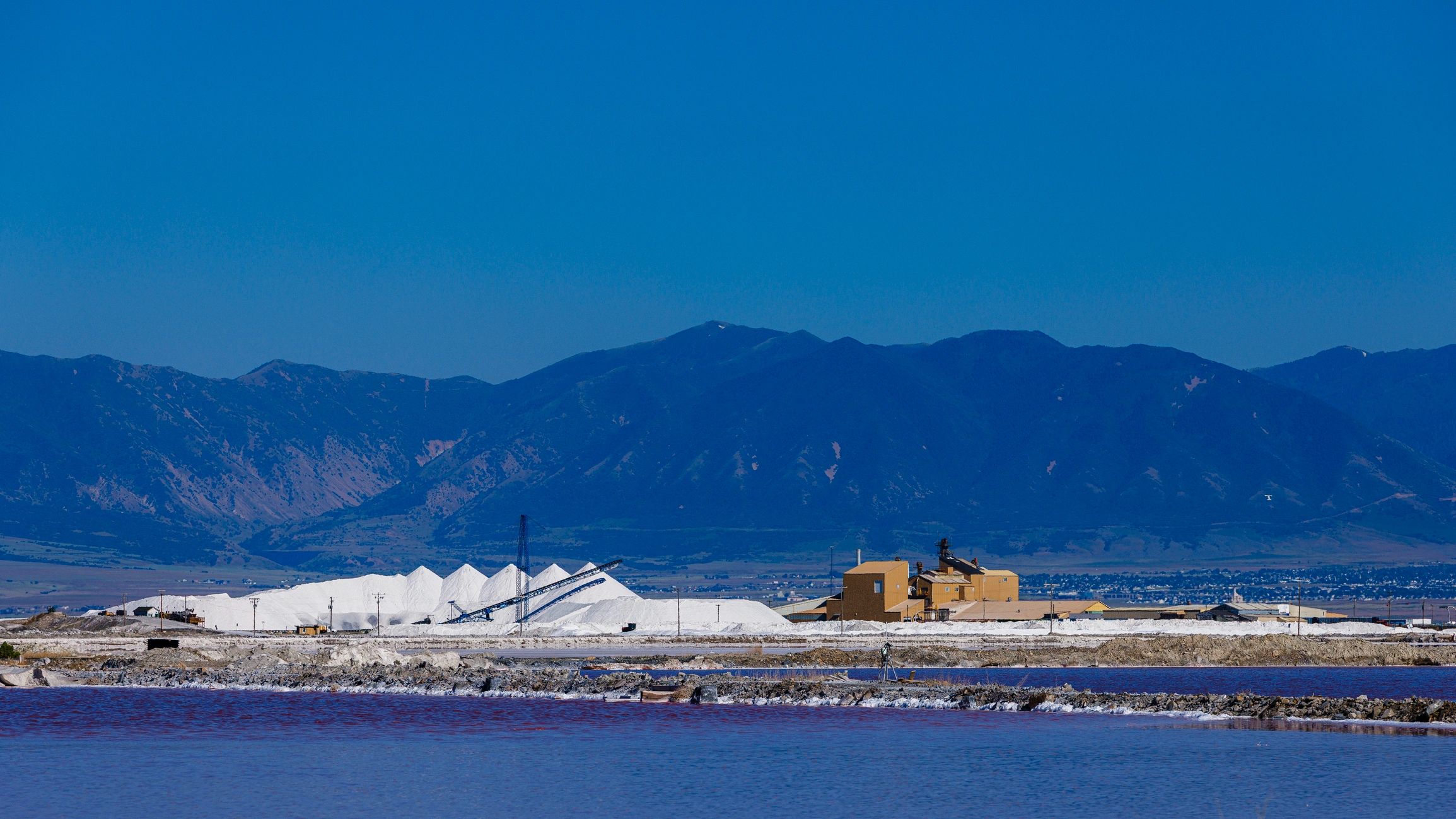 Mineral processing plant with conveyors and industrial infrastructure